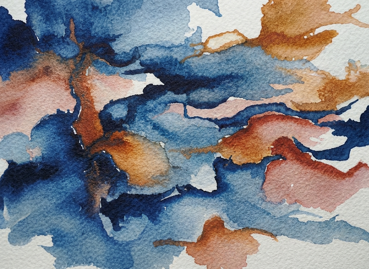 A close-up photographic view of an unfinished abstract painting on thick, textured watercolor paper taped to a smooth wooden board. Swirls of deep blues, warm ochres, and soft rose tones blend together, with visible brushstrokes and areas where water has pooled and dried, hinting at layered emotions. Around the edges of the frame lie well-used brushes, a porcelain palette dotted with mixed colors, and a cotton cloth stained with paint. Soft, diffused morning light from an unseen window grazes the surface at a slight angle, revealing subtle paper texture and casting delicate shadows. Captured from a slightly elevated angle with shallow depth of field, the central part of the artwork is in crisp focus while the tools gently blur, conveying introspective calm and the quiet intensity of art therapy in progress.